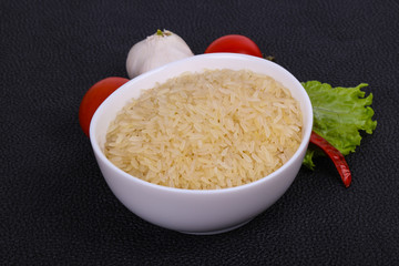 Raw uncooked rice in the bowl