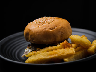 Hamburger in black background.