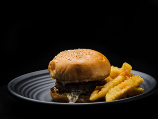 Hamburger in black background.
