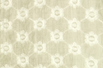Obraz premium Embroidered blue flowers on a white background.