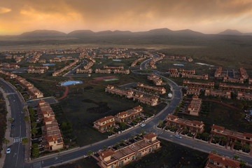 Obraz premium Tenerife village and town area at sunset with streets of apartments and homes