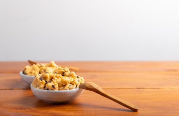 a serving of homemade cookie dough on a white background.