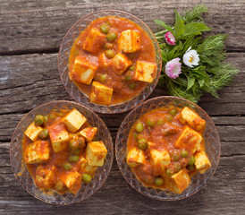 Tradition indian food - cheese paneer with peas in spicy tomato sauce