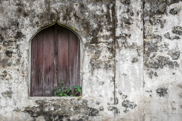 Fototapeta na wymiar Old wooden window on historic buildings
