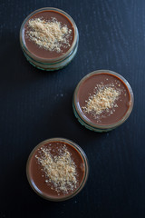 Home made sweet chocolate caramel cheesecake in a jar