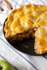Homemade apple pie on cloth, low angle view. Closeup.