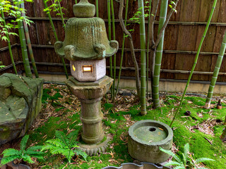 A stone lantern at the corner of Japanese garden in Kanazawa, Japan