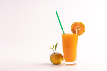 Pure orange juice no sugar, fresh from oranges fruit, healthy and refreshing drink in a glass with green straw. On isolated white background.