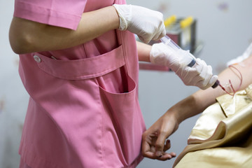 The nurse is holding hands hold the patient's blood,Blood Collection Science Sample Examination for Health Care