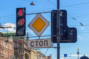 Traffic lights and road signs at a busy intersection