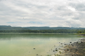 Lake against a mountain and forest background, Lake Elementaita, Kenya