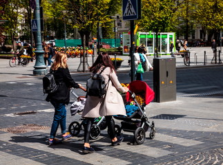 Obraz premium The young moms in Vilnius street