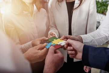 Teamwork of partners. Concept of integration and startup with puzzle pieces.