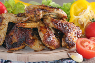 Chicken wings barbecue with different vegetables