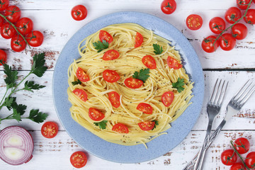 A plate with spaghetti with tomatoes	