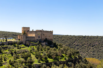 Pedraza, Castilla Y Leon, Spain: view of Pedraza Castle perched on a cliff from Mirador the Tungueras. Pedraza is one of the best preserved medieval villages of Spain