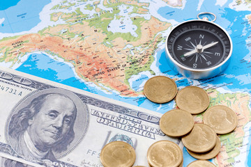 Fototapeta na wymiar Financial Concept : US Dollar Coin and Compass on America Map Background.