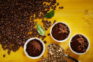 Roasted and raw coffee beans with grounds