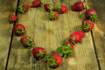 fresh strawberries on wooden background