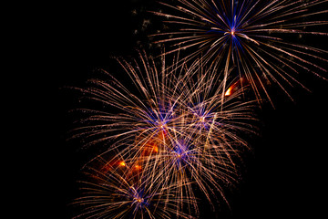 background of multi-colored salute and fireworks closeup on a black background