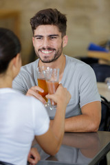 couple drinking beer inside