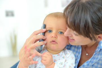 mum baby and a phone