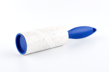 Roller cleans clothes Isolated on white background. Adhesive lint roller.