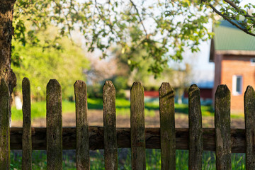 Wooden fence and nature. Background with copy space. Ukrainian village theme