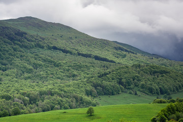 Dramatic stormy weather clouds over peaks in Bieszczady National Park, Poland