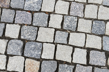 the old road is a sidewalk paved with granite