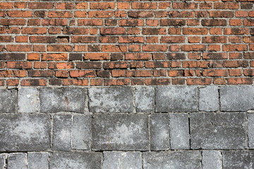 old wall of grey stone and red brick