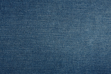 Denim jeans texture background with torn. The texture of the colored cotton fabric. Stitched texture jeans background. Fashion jeans button. Pocket and rivet on jeans. Fiber and fabric structure.
