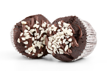 Tasty chocolate cupcakes on white background. Chocolate caramel cupcake and butterscotch syrup. Chocolate cupcake isolated on white.