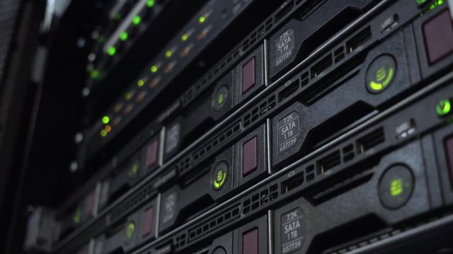 Green Hard Disk Light on Rack Server. Data center rack with hard drives.
