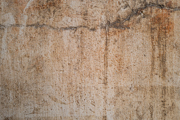 Fond grunge, vieil enduit avec des salissures sur un batiment ancien.