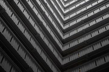 Abstract building facade concrete void or tunnel with natural light in the end / architecture design / abstract concept / background texture