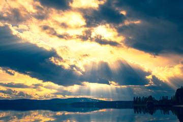 Naklejka na ściany i meble Summer lake landscape with fine reflections and dramatic sky. Sotkamo, Finland.
