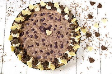 Chocolate chip cookie cake on white background