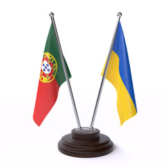 Portugal and Ukraine, two table flags isolated on white background. 3d image