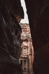 Narrow gorge and temple in rocks in desert of Jordan, Asia