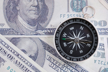 Financial Concept : US Dollar and Compass.