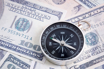 Financial Concept : US Dollar and Compass.