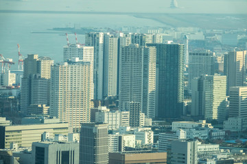 Naklejka premium Aerial View Of Tokyo City Buildings Against Cloudy Sky