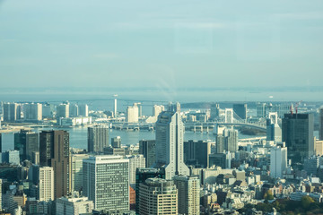 Obraz premium Aerial View Of Tokyo City Buildings Against Cloudy Sky