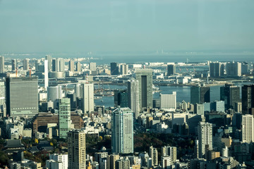 Obraz premium Aerial View Of Tokyo City Buildings Against Cloudy Sky