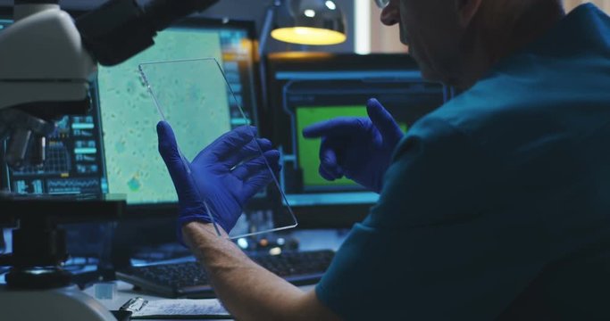 Scientist using transparent display screen