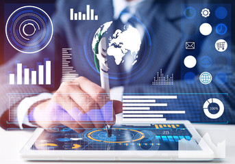 Businessman analyzing financial data at tablet