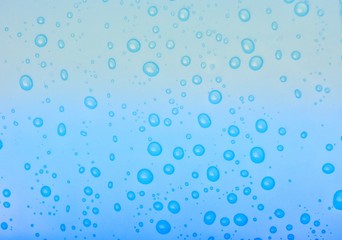 Fototapeta na wymiar Water drops on blue background