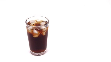 Cola drink in glass with ice