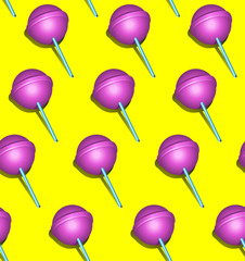 Seamless pattern of bright pink lollipop on yellow background, morden and popular art background